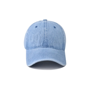Detailed view of washed denim baseball cap with six-panel structure and stitched brim