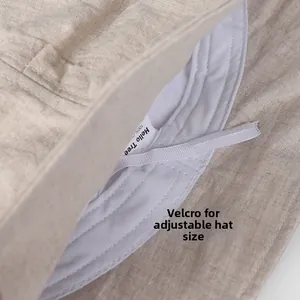 Detail of breathable linen sun hat featuring an adjustable inner strap for custom fit