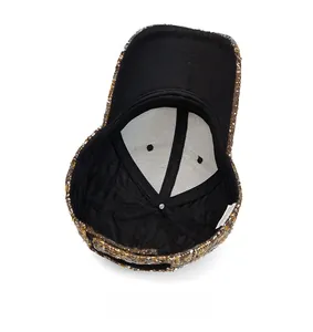 Detailed internal view of tweed baseball cap showing black lining and top ventilation holes
