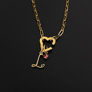 Gold stainless steel necklace featuring heart carabiner clasp and pink gemstone L pendant