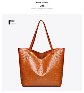 Front view of a brown crocodile pattern tote bag made of high-quality synthetic leather