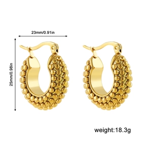 Macro view of gold chunky hoop earrings with beaded texture showing 23x25mm dimensions