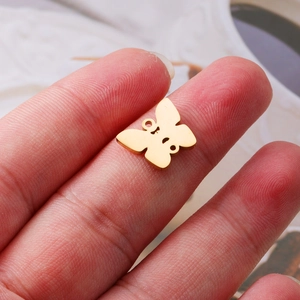 Polished gold stainless steel butterfly pendant accessory for DIY jewelry on fingertip