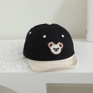 Detailed embroidery of cute bear and polka dots on black and white cotton toddler cap