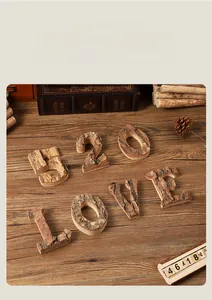 Macro detail of rustic wooden letters and numbers with natural birch bark texture