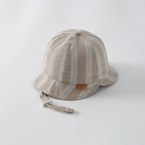 Detail of baby striped sun hat showing cotton fabric texture and windproof chin strap