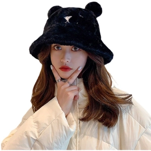 Winter plush bucket hat with bear ears in black faux fur shown on a female model