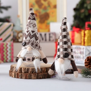 Christmas gnome coffee storage jar with knitted hat and faux fur on rustic wood base