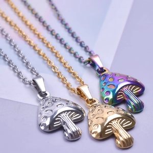 Rainbow, gold, and silver stainless steel mushroom pendant necklaces on a pastel background