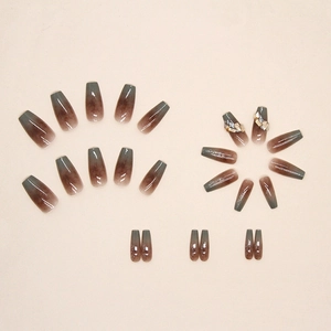 Amber gradient coffin press-on nails with yellow diamond and 3D metallic accents