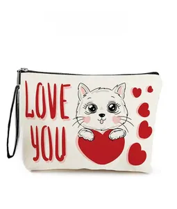 Close-up of a white canvas makeup bag featuring a cute cat with a red heart and Love You text