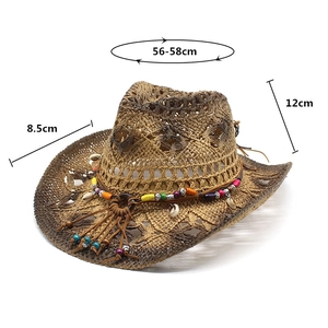 Macro detail of straw cowboy hat featuring ethnic beads, shells and woven texture