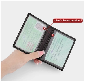Detail view of leather wallet with two transparent PVC card slots for driver license