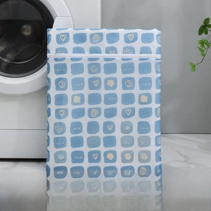 Blue plaid mesh laundry bag 40x50cm shown next to washing machine for clothing care