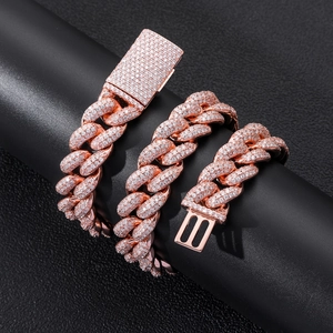 Detail of rose gold Cuban link necklace featuring micro-pave cubic zirconia on black stand