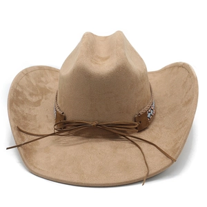 Detail of western cowboy hat with ethnic geometric pattern embroidery and leather bow