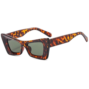 Fashionable tortoise shell cat-eye sunglasses with dark grey lenses and geometric frames