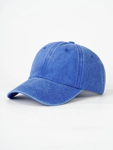 Detail of navy blue washed cotton baseball cap with vintage texture and stitched eyelets