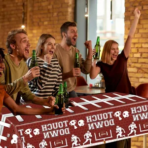 Disposable American football field tablecloth with Touch Down graphics and helmet patterns