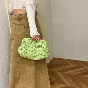 Woven mint green shell-shaped clutch bag with chain strap and frame closure