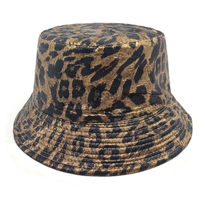 Close-up of metallic leopard print bucket hat featuring gold foil finish and stitching