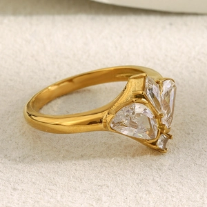 Elegant 18K gold plated butterfly ring with sparkling cubic zirconia on a textured surface