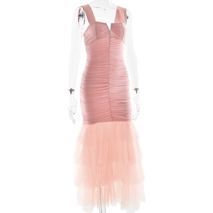 Detailed view of pink bodycon dress with layered mesh ruffles and fishtail hemline