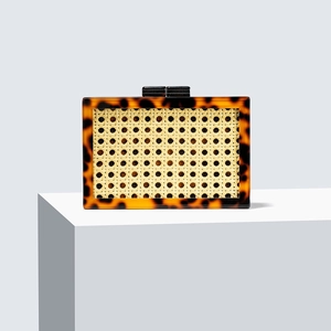 Elegant green rectangular wicker clutch with tortoiseshell texture and top clasp detail
