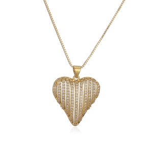 Elegant gold-plated heart pendant necklace with shimmering zircon stones on white background