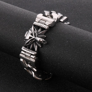 Close-up of vintage wolf head stainless steel bracelet with heavy chain texture