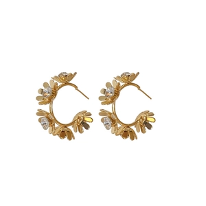 Vintage C-shaped golden earrings with crystal flowers in a minimalist geometric style