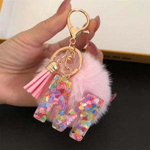 Colorful resin M letter keychain with heart sequins, pink pompom and tassel