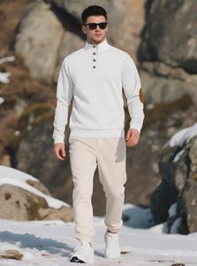 Close-up of white knitted sweater with brown elbow patches and buttoned stand collar