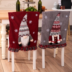 Christmas gnome chair covers with 3D plush figures and festive red plaid ruffle trim