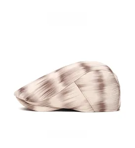 Detail view of the stitching and brown gradient stripes on a retro ivy cap