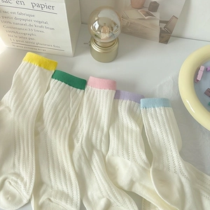 Breathable mesh crew socks in assorted macaron colors with pastel cuffs for women