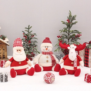 Knitted Christmas plush dolls with Santa, Snowman, and Reindeer set on festive snow scene