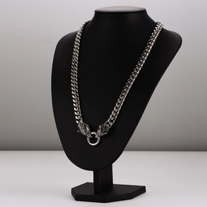 Vintage stainless steel wolf head pendant necklace on display mannequin for men