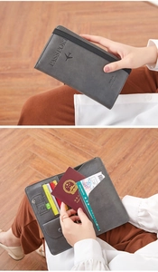 Dual view of gray travel passport wallet showing exterior and interior storage layout
