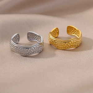 Minimalist adjustable wave rings with hammered texture in gold and silver finish