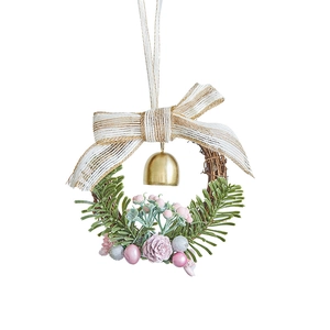 Christmas wreath with gold bells, striped bow, pink pine cones and berries on white background
