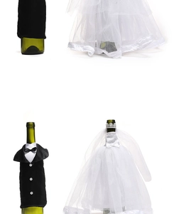 Detail view of bride and groom wine bottle covers with white lace and black suit fabric