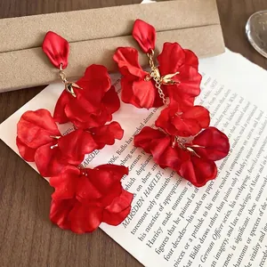 Elegant oversized red fabric flower petal drop earrings with gold metallic accents