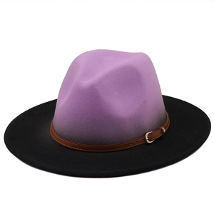 Macro view of gradient wool fedora hat with brown leather band and gold buckle detail