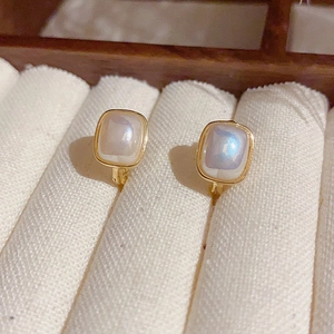 Elegant square pearl hoop earrings with golden frame and iridescent shimmer effect