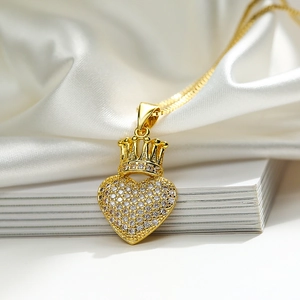 Luxurious gold-plated heart and crown pendant necklace with pavé-set cubic zirconia