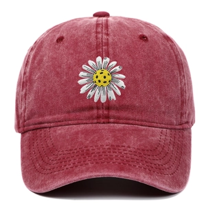 Detailed embroidery of a white daisy on a vintage burgundy washed cotton baseball cap