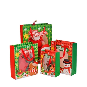 Christmas paper gift bags featuring Santa and reindeer designs in multiple sizes