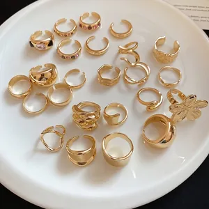 Set of minimalist geometric gold-plated open rings with unique irregular metal textures