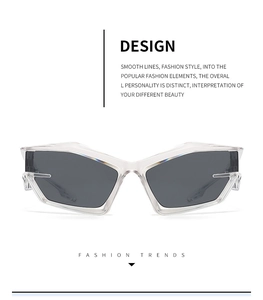 Close-up of futuristic Y2K sunglasses with transparent frames and dark grey lenses